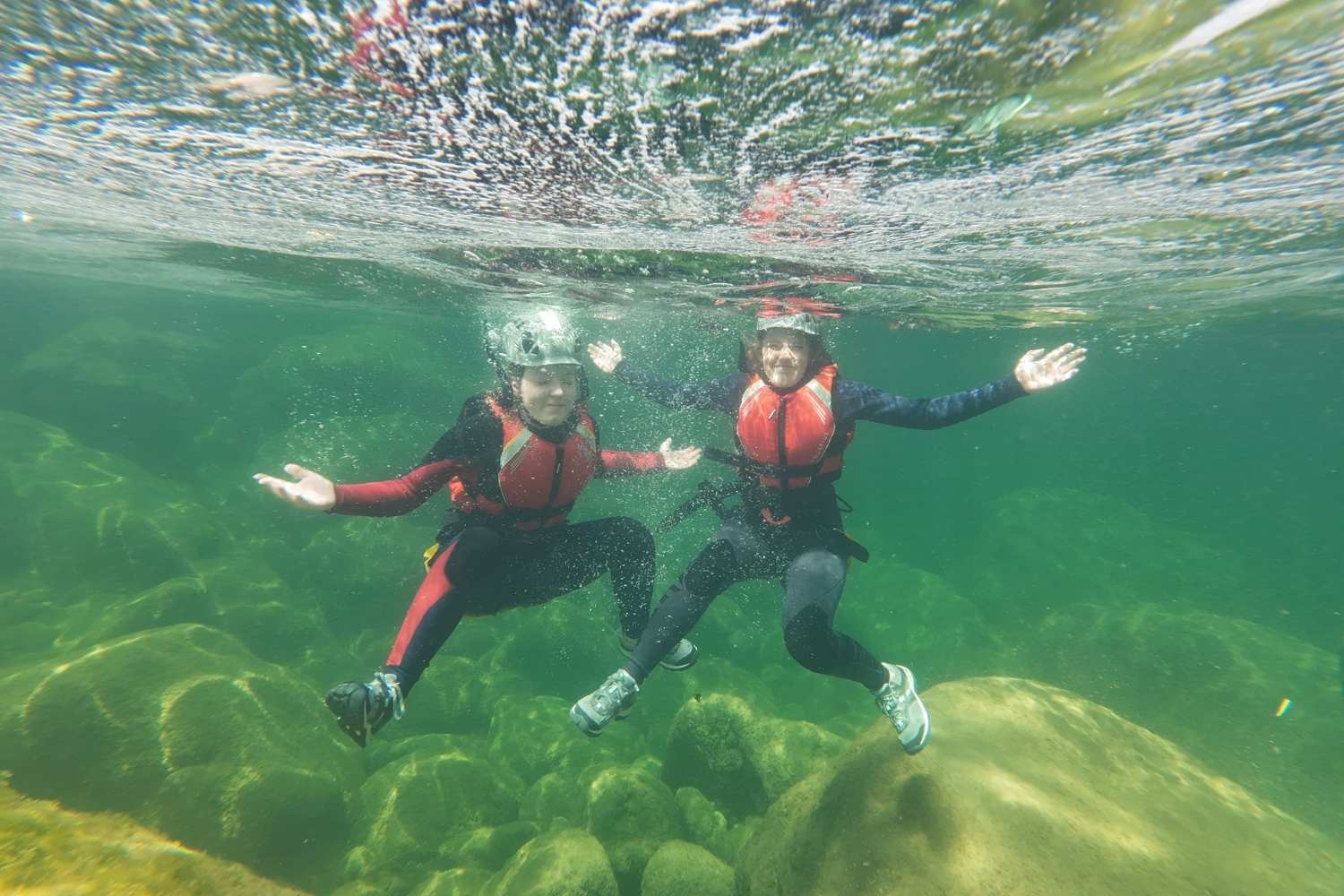 Swimming through emerald pools during canyoning near Split on the Cetina River
