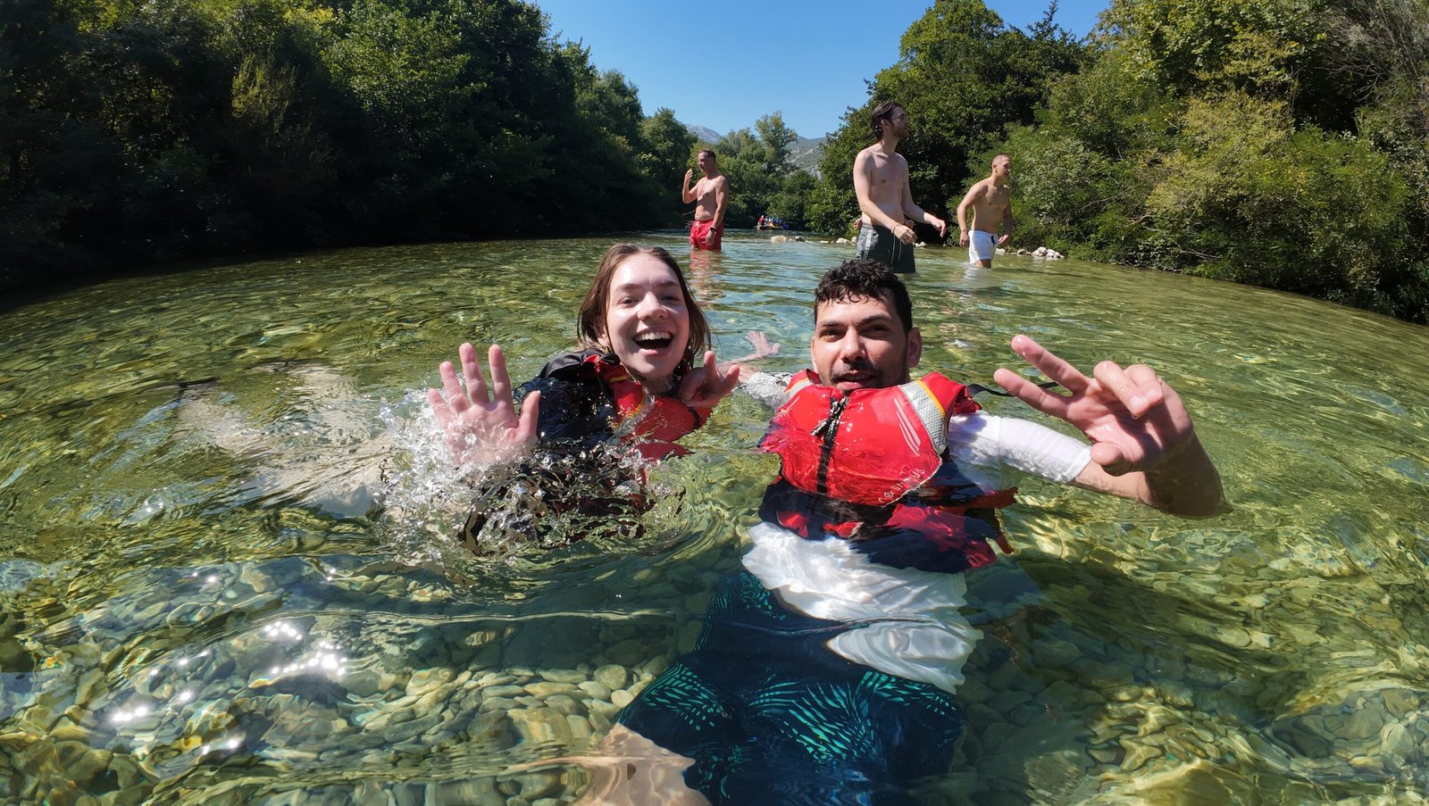 Swim break in a clear emerald pool on the Cetina rafting route