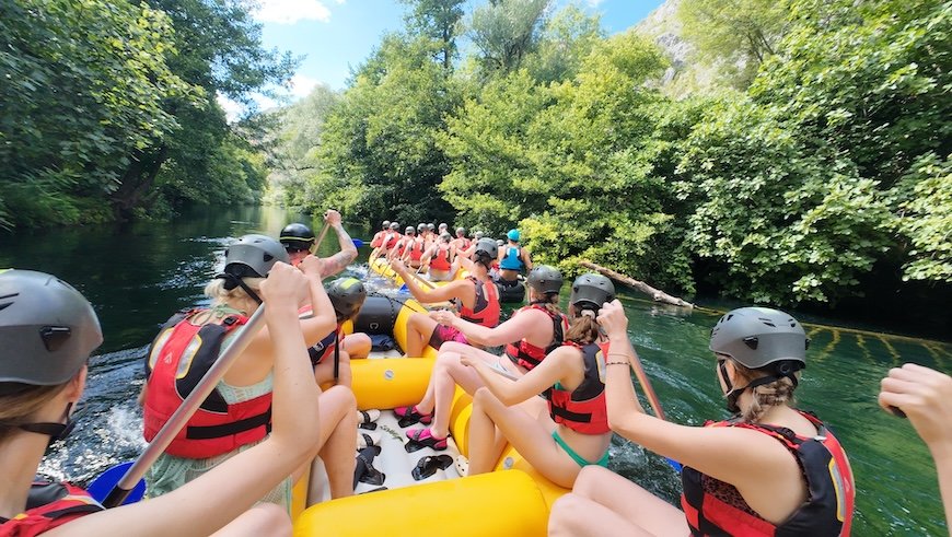 Rafting guests in helmets and life jackets on the Cetina near Omis