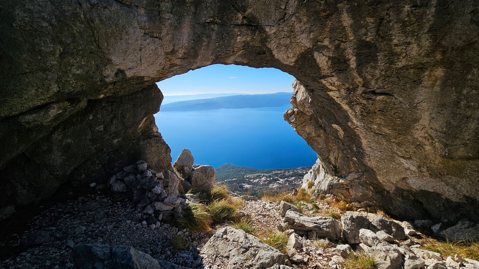 Biokovsko Oko (Šuplja Stina) rock arch on Biokovo above Brela